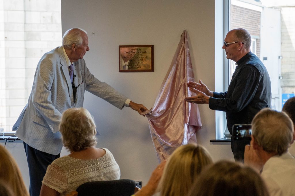 Lord Shulleworth unveils the plaque aided by Pastor Mick